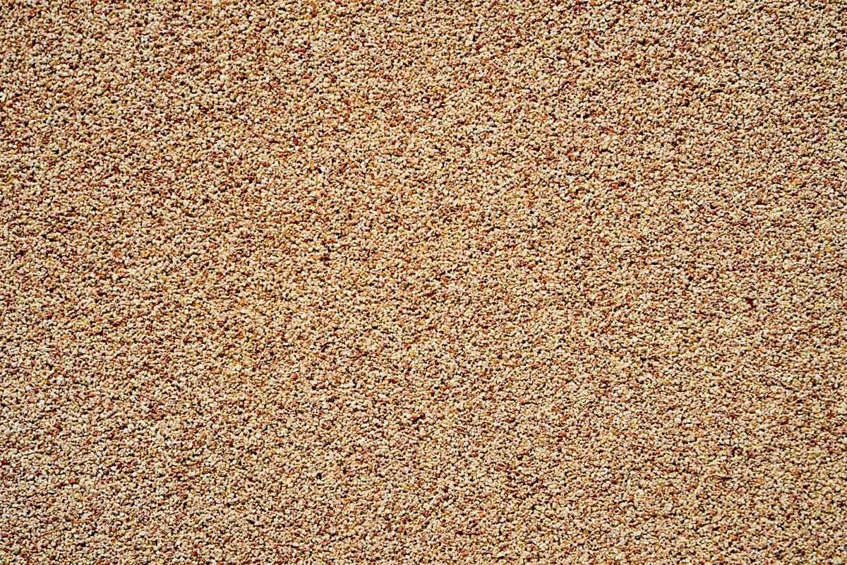 Close-up of a beige and brown speckled textured surface