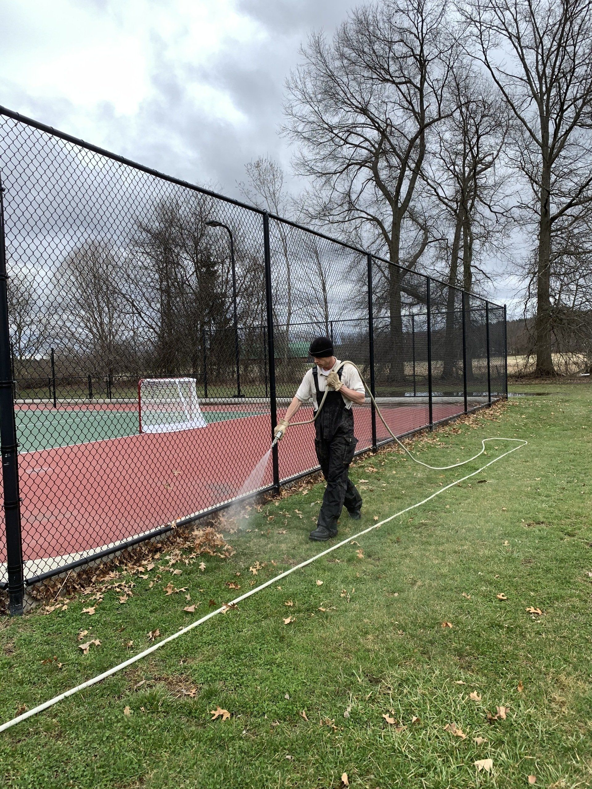 Watering Field Grass — Kingston, NY — Roots Up Plant Health Inc.