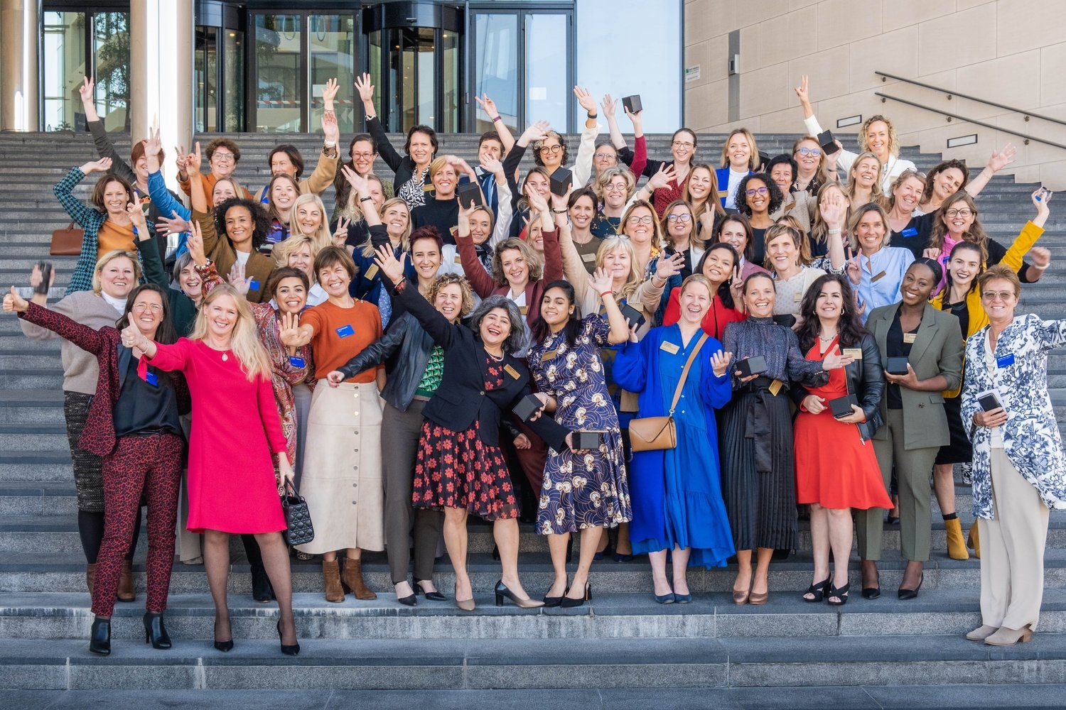 Group photo oh the InspiringFifty waving - CEO Miet Loix