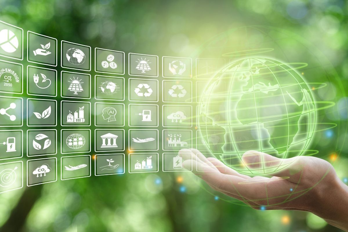 Hand holding glowing green globe with environmental icons overlay Sky-Walker