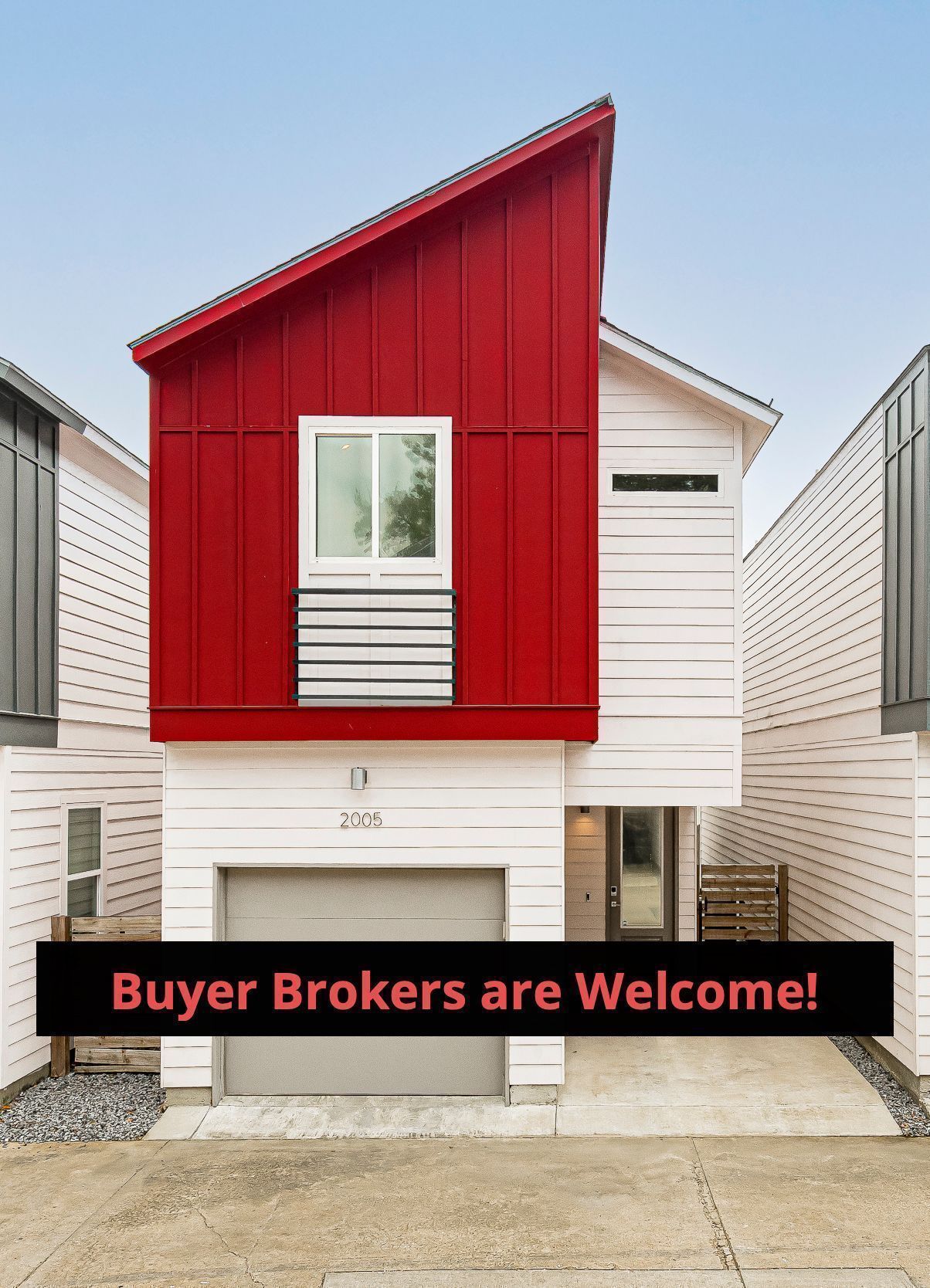 A red and white house with a sign that says buyer brokers are welcome