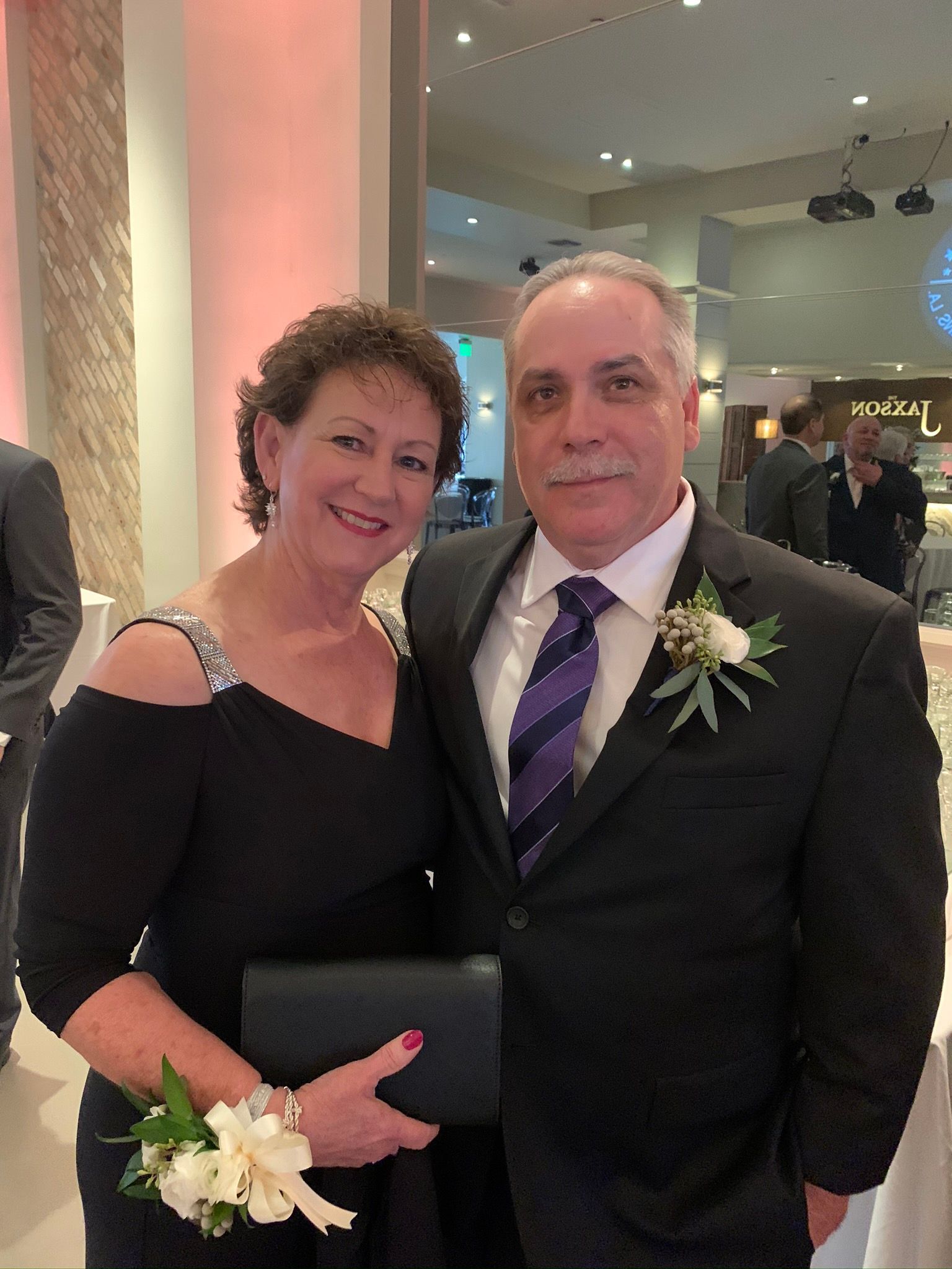 A man and a woman are posing for a picture together