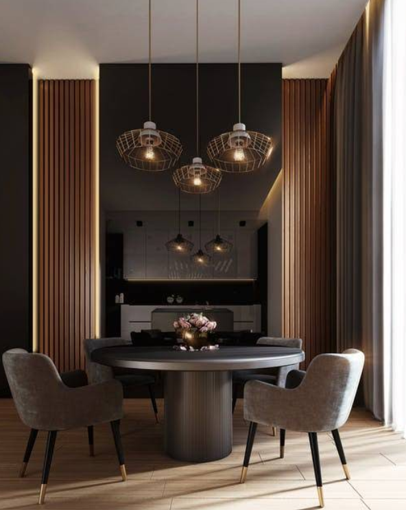 Dining room with a round table, gray chairs, and three pendant lights. Black wall and wooden accents.
