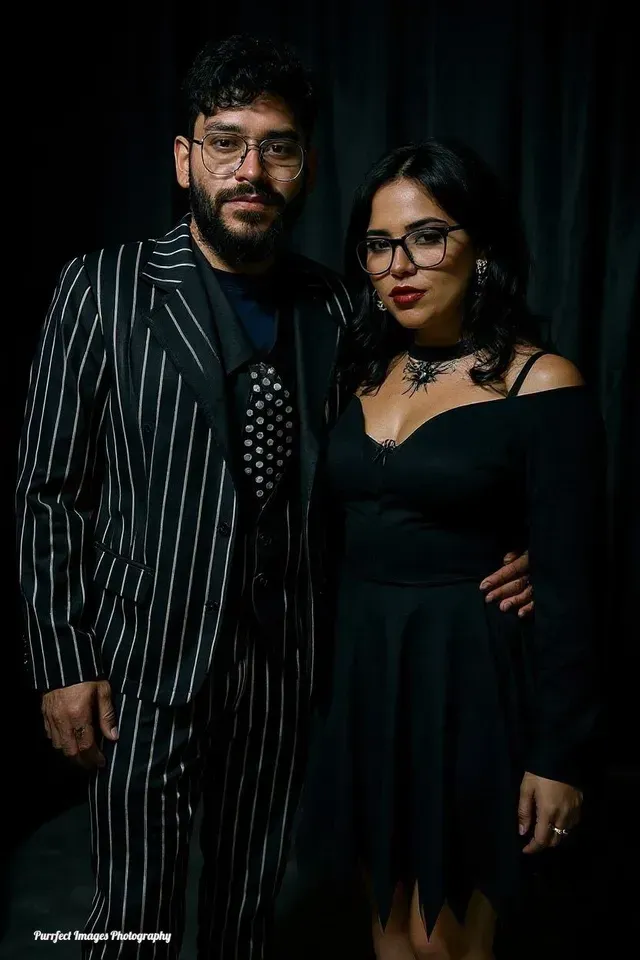 A Couple Poses Against a Dark Background — Costumes Galore in Fraser Coast, QLD