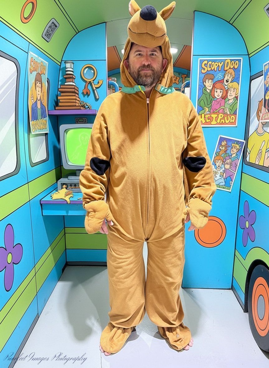 Man in Scooby Doo costume stands in front of a Mystery Machine replica interior — Costumes Galore In Maroochydore, QLD