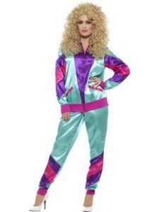 Woman in a Colorful 1980s Tracksuit and Wig, Posing With White Heels — Costumes Galore in Maroochydore, QLD