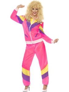 Person in 80s Tracksuit and Blonde Wig, Smiling, Arms Raised — Costumes Galore in Maroochydore, QLD