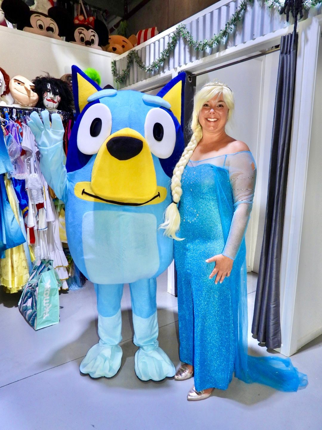Person in Elsa Costume Beside Friendly Cartoon Dog Mascot — Costumes Galore in Fraser Coast, QLD
