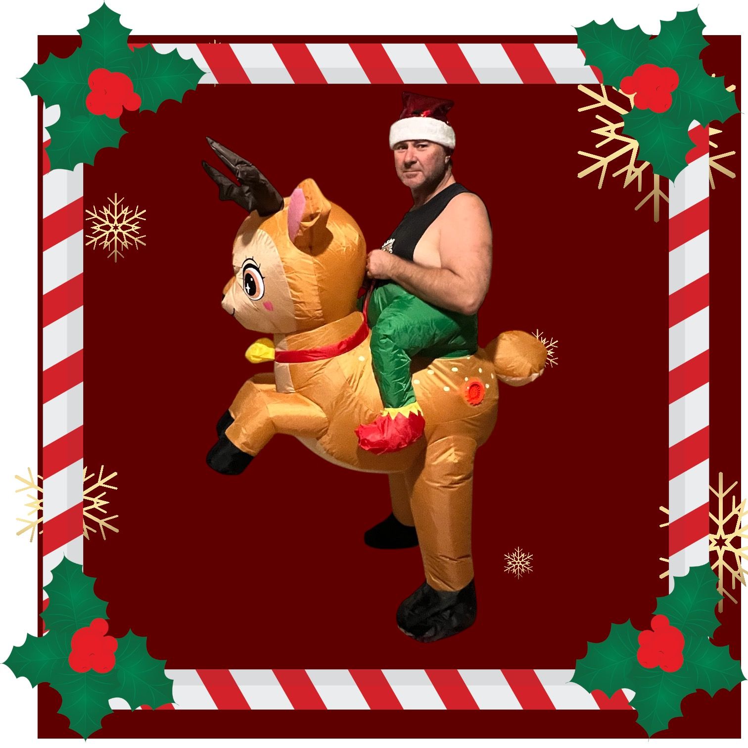 Man in elf costume riding an inflatable reindeer, framed by a Christmas border.