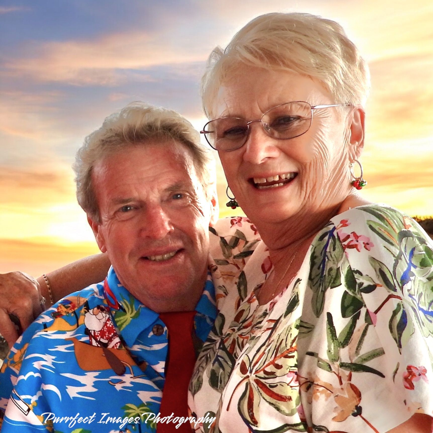 Smiling Pair Poses Closely Together Outdoors Against a Colorful Sunset — Costumes Galore in Fraser Coast, QLD
