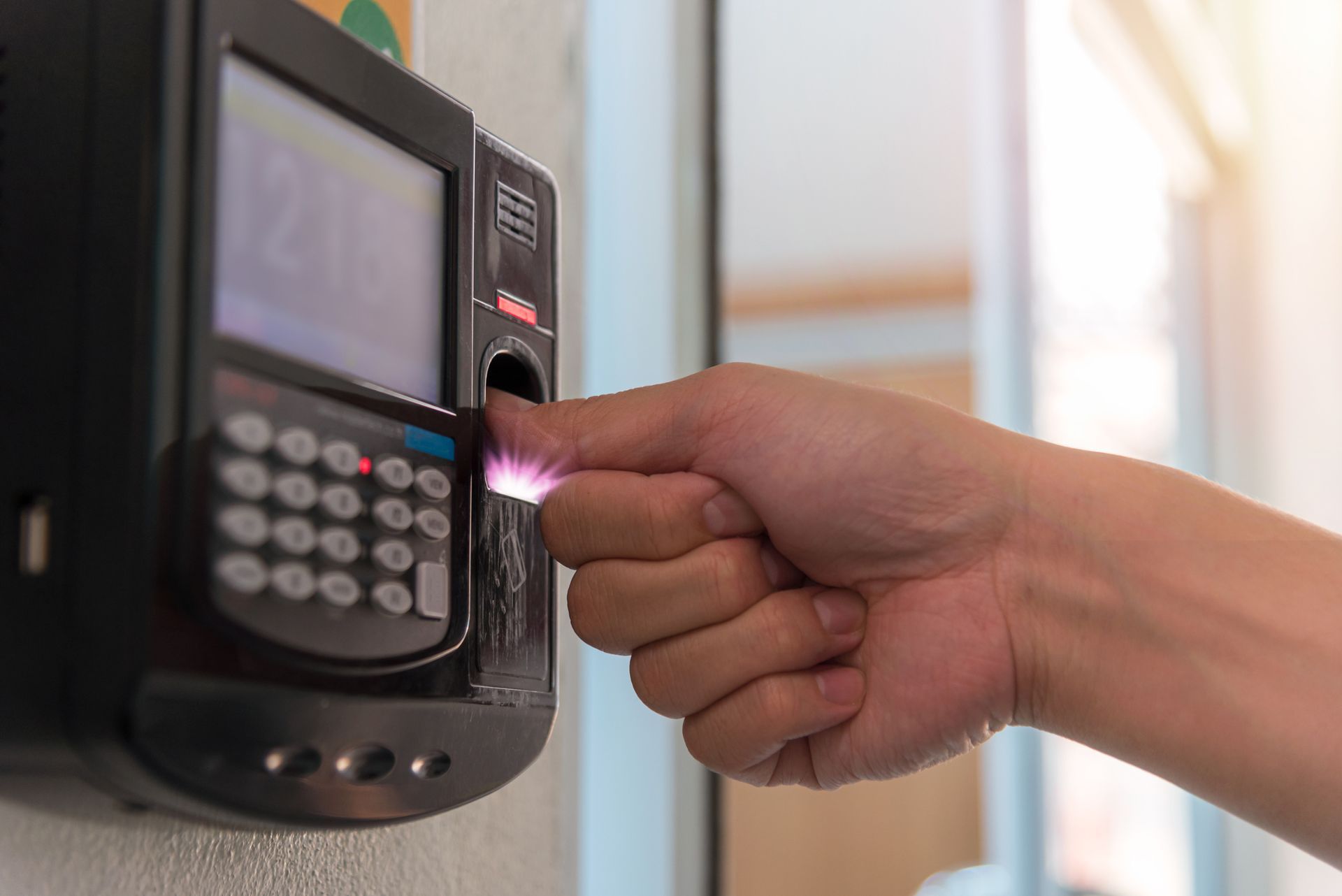 ACE Security Solutions access control systems in San Antonio, TX - Fingerprint scan for secure entry system.