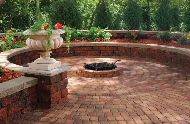 There is a fire pit in the middle of the patio.