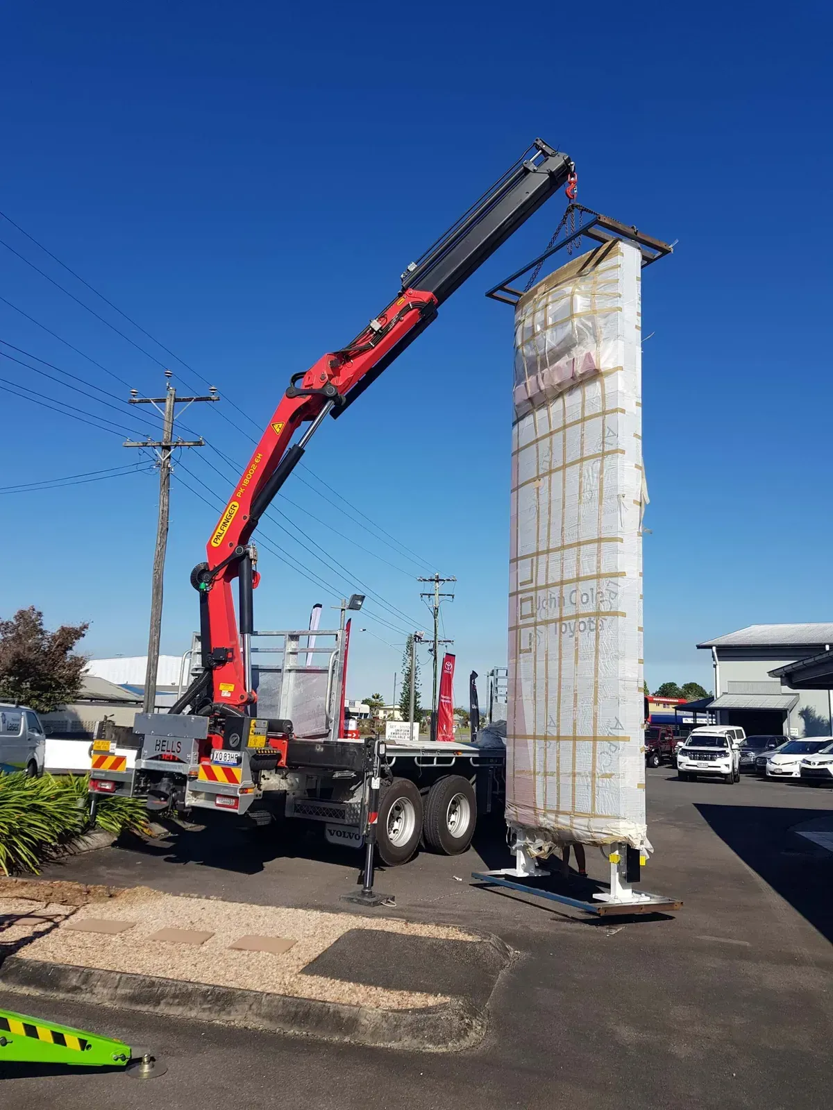 Crane Lifting a Tall — Bell's Carrying & Crane Hire Service Pty Ltd in Atherton, QLD