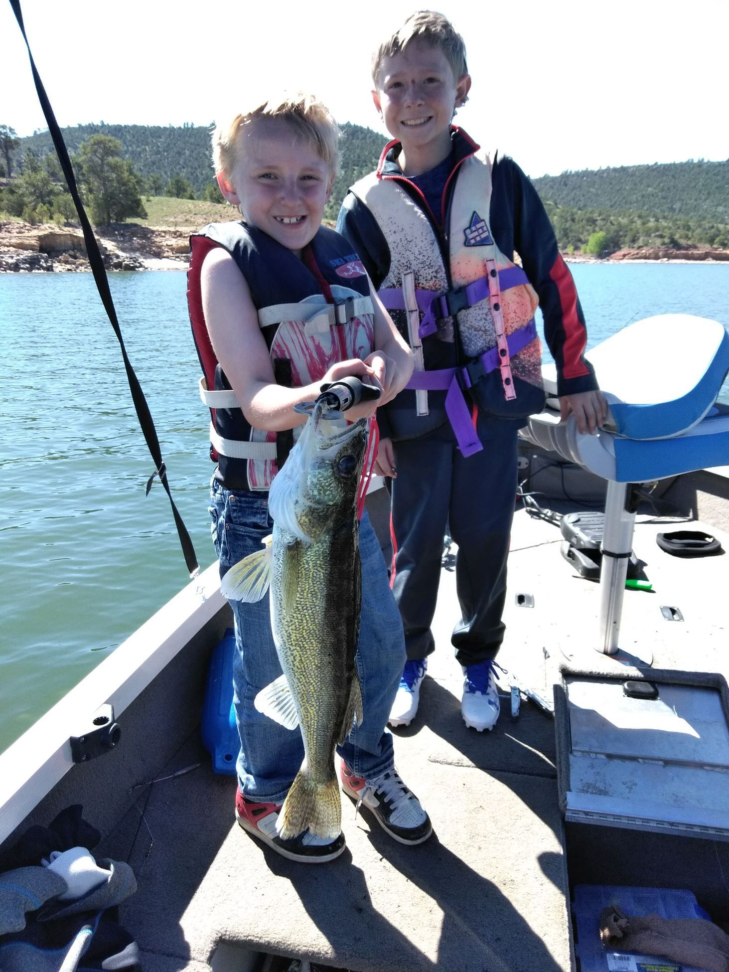 kids on boat fishing