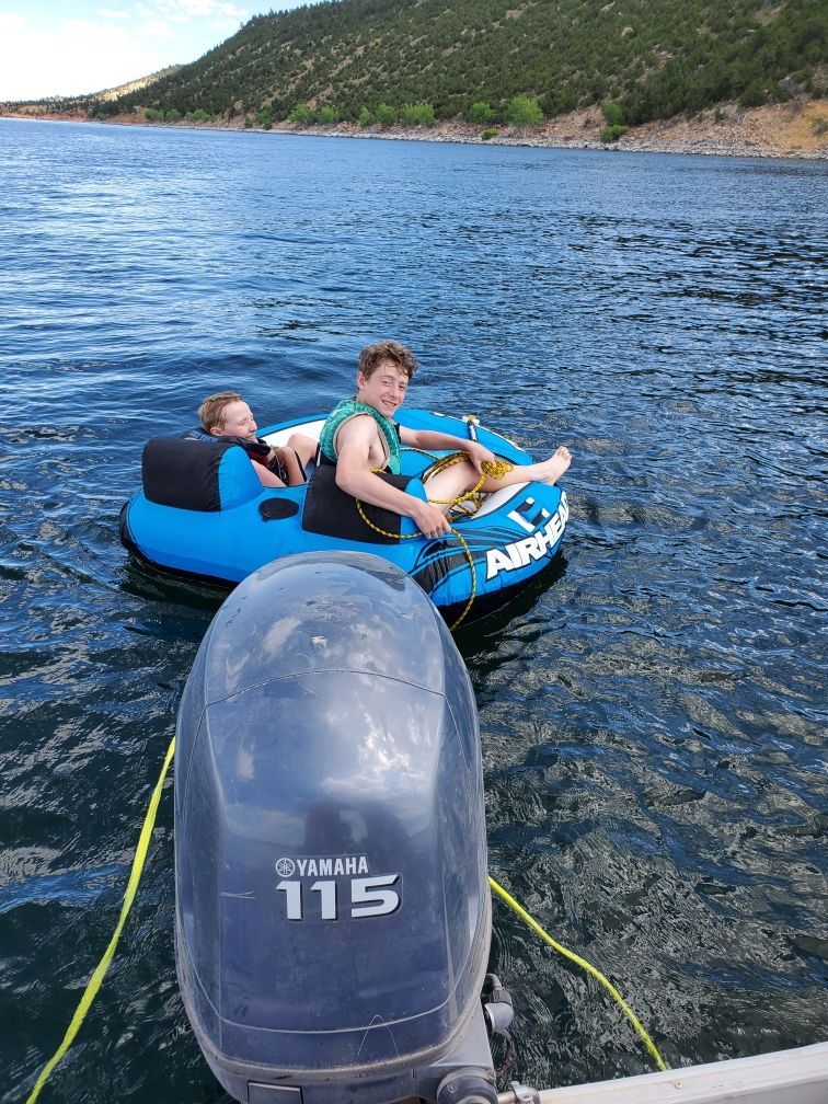 kids on tube in lake