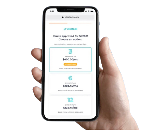 Hand holding a phone displaying a loan approval from