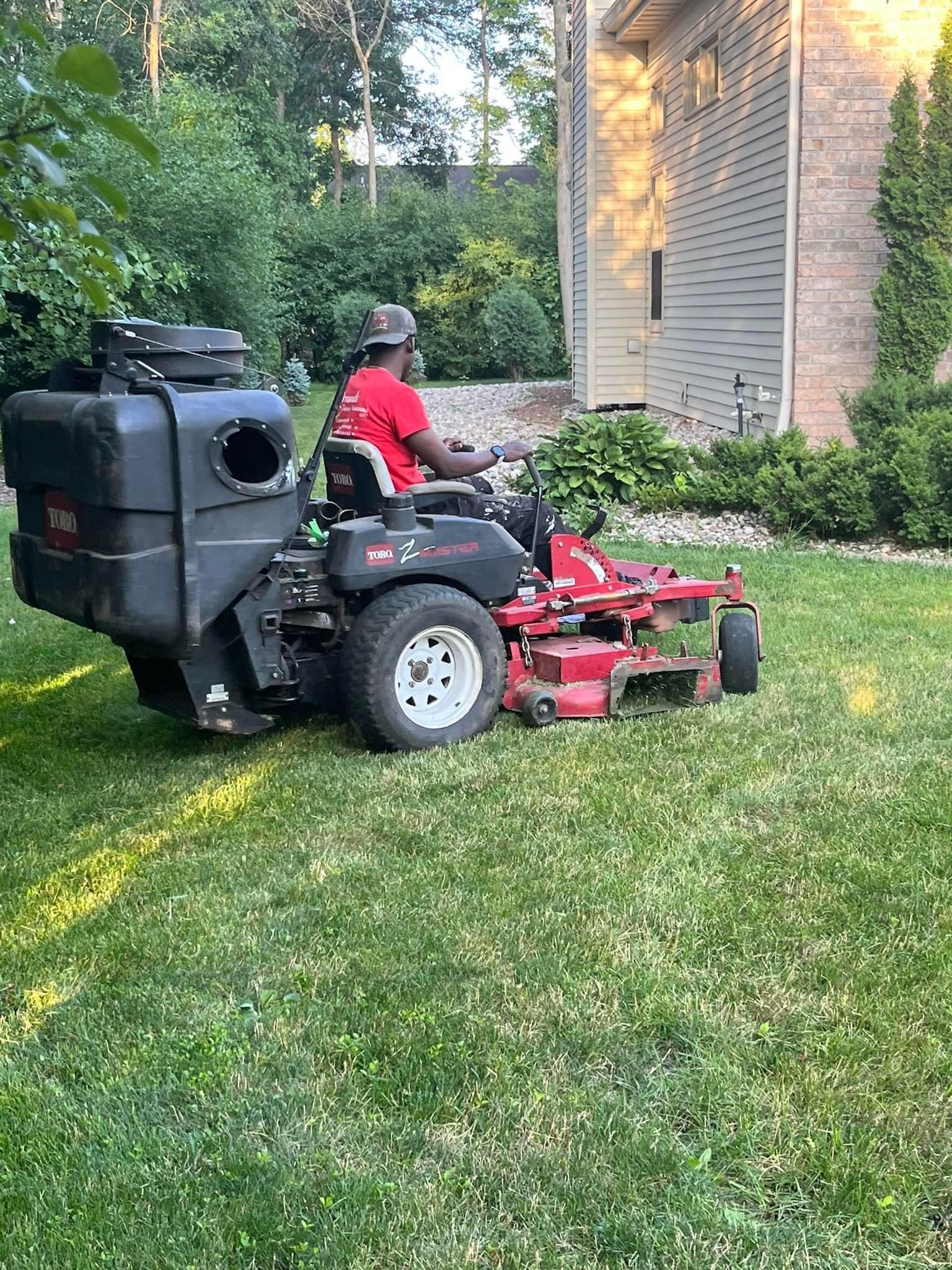 A Man is Riding a Lawn Mower – Appleton, WI - Errands & Property Maintenance 
