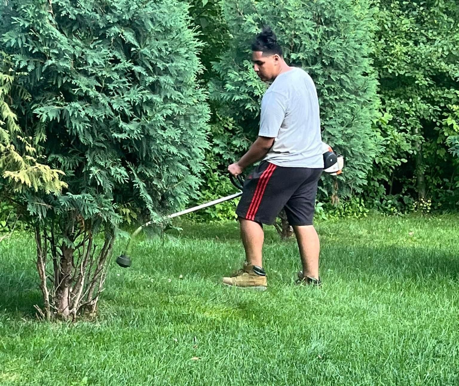 A Man is Using a Lawn Mower – Appleton, WI - Errands & Property Maintenance 
