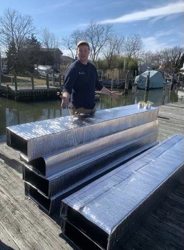 contractor standing next to new air ducts