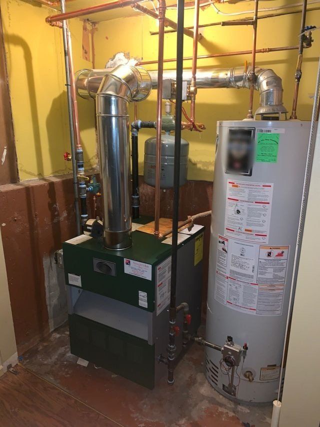 furnace and hot water tank in basement
