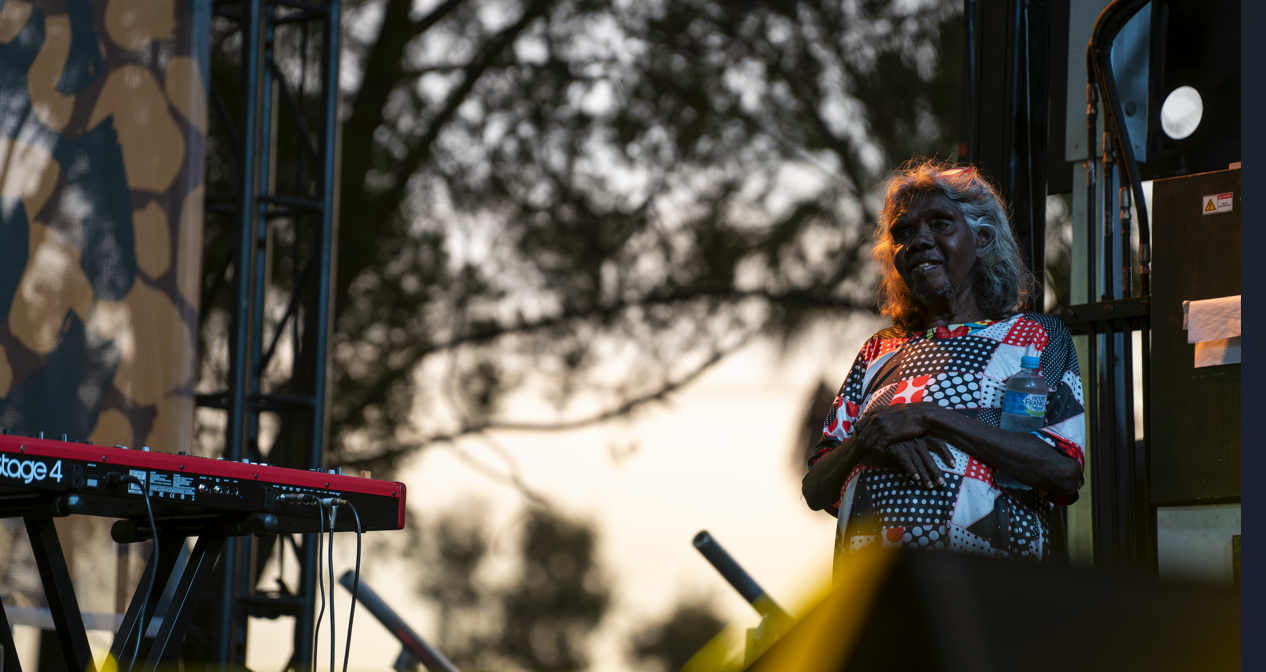 A lady presenting at a community event.