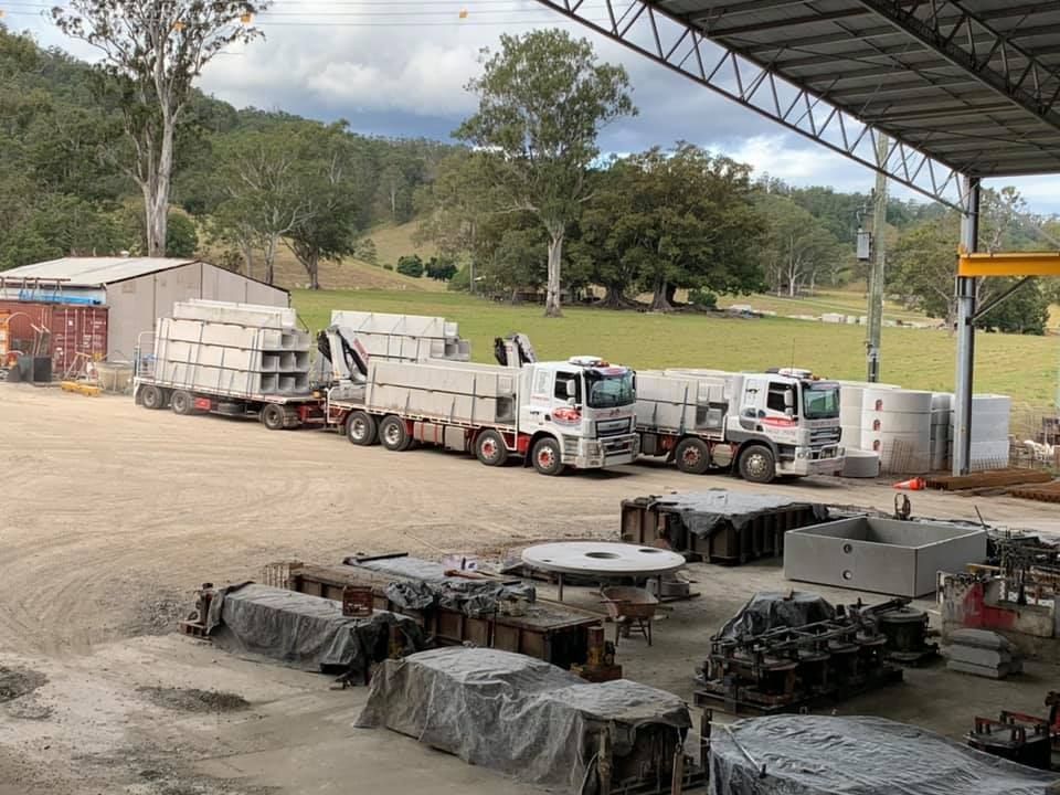 A Row of Trucks Are Parked in a Parking Lot — Graham's Precast Concrete Products Pty Ltd in Kyogle, NSW