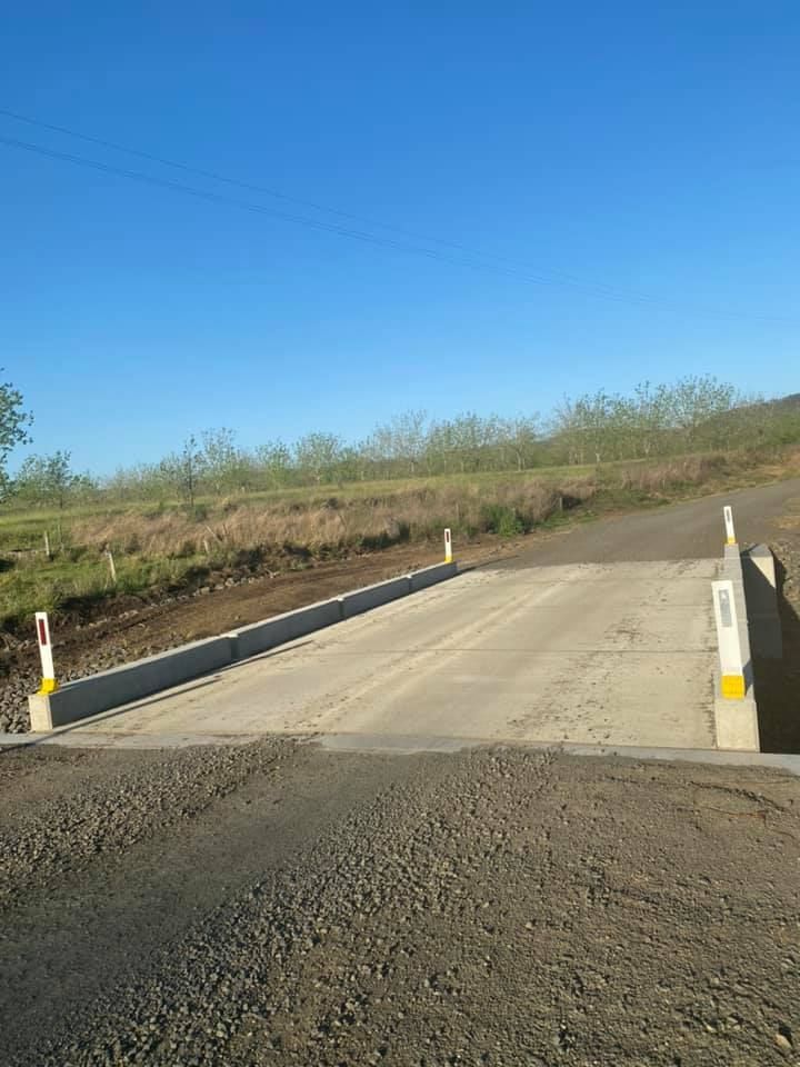 A Bridge Over a Dirt Road With a Blue Sky in the Background — Graham's Precast Concrete Products Pty Ltd in Kyogle, NSW