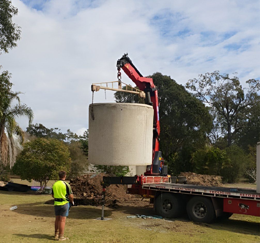 A Large Concrete Cylinder is Being Lifted by a Crane — Graham's Precast Concrete Products Pty Ltd in Kyogle, NSW