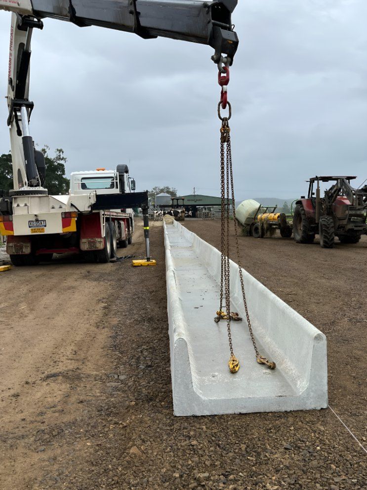 A Large Piece of Concrete is Being Lifted by a Crane — Graham's Precast Concrete Products Pty Ltd in Kyogle, NSW