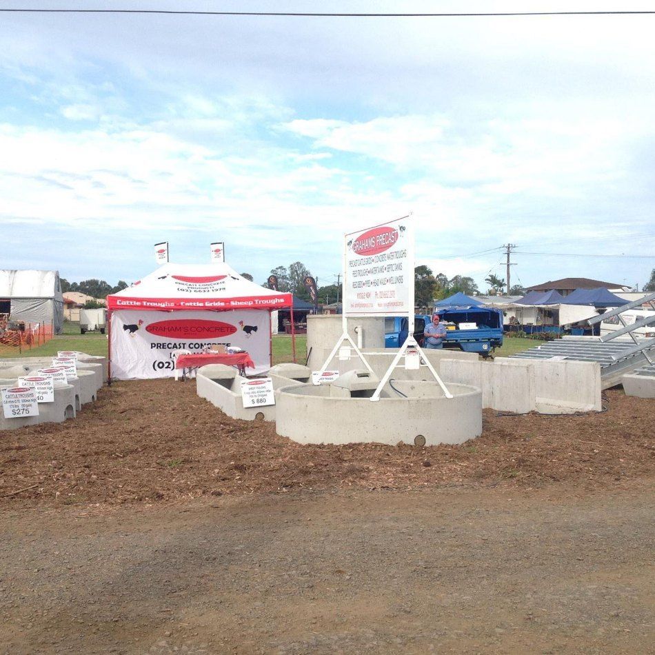 A Sign That Says ' Bricks ' on It in a Field — Graham's Precast Concrete Products Pty Ltd in Kyogle, NSW