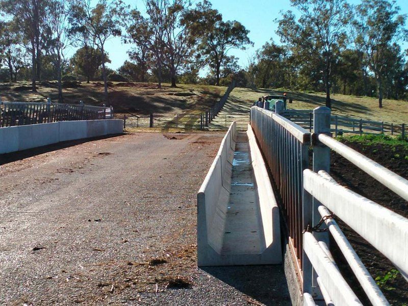 A Large Concrete Trough Sits in the Middle of a Dirt Road — Graham's Precast Concrete Products Pty Ltd in Kyogle, NSW