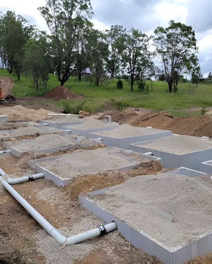A Construction Site With a Lot of Concrete and Pipes — Graham's Precast Concrete Products Pty Ltd in Kyogle, NSW