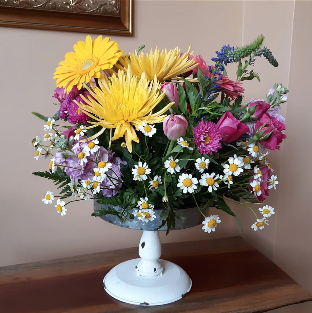 A vase filled with flowers is sitting on a table