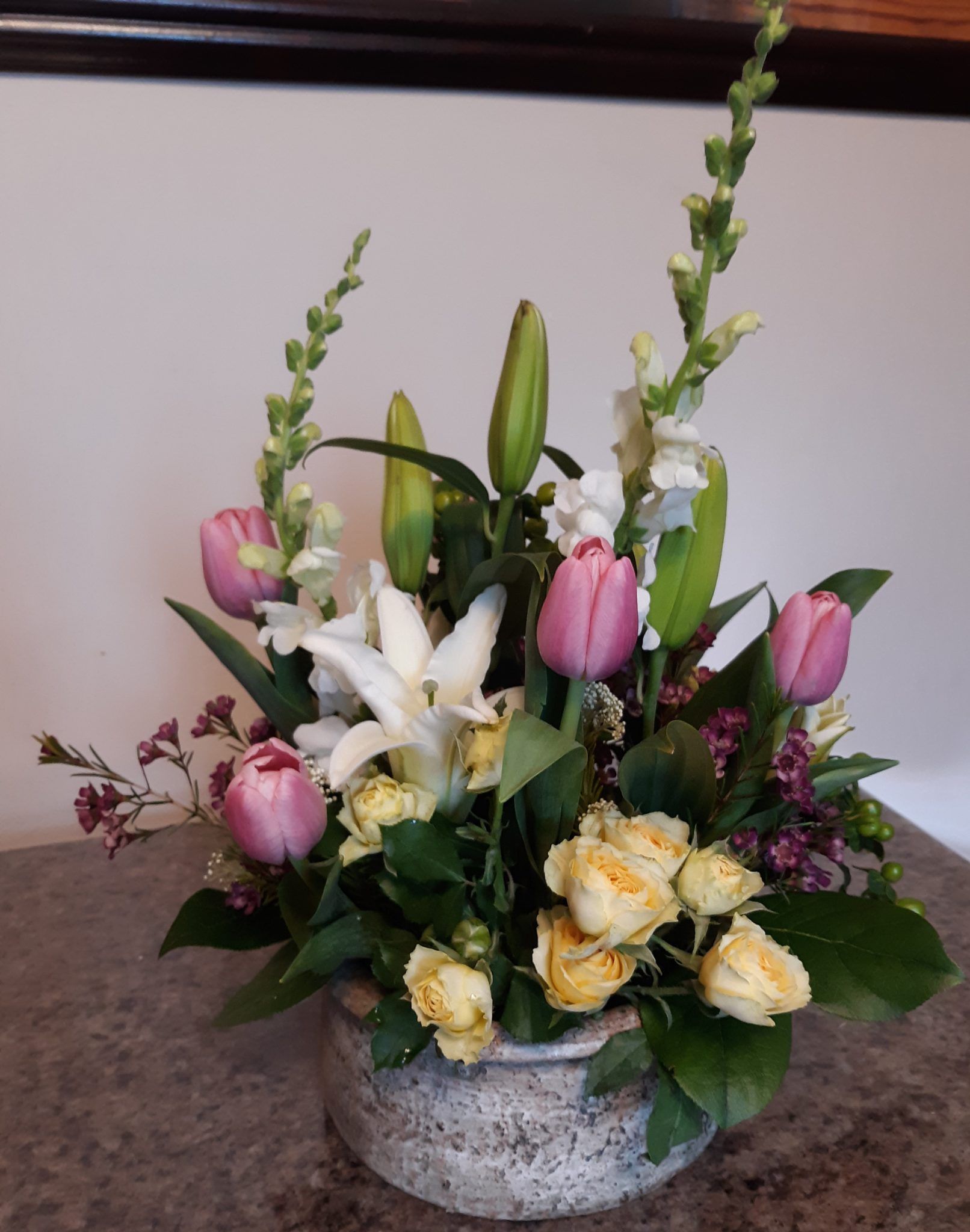 A vase filled with flowers is sitting on a table