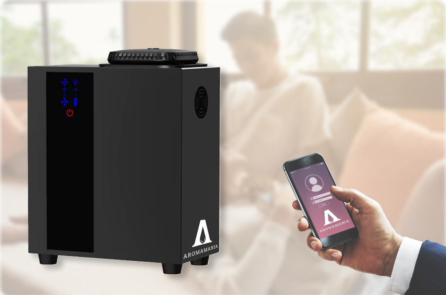 A person is holding a cell phone in front of a speaker.