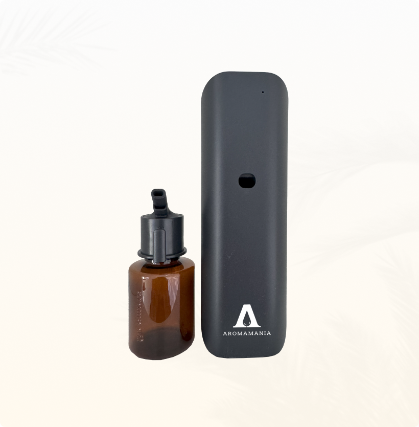 There is a bottle of liquid next to a device.