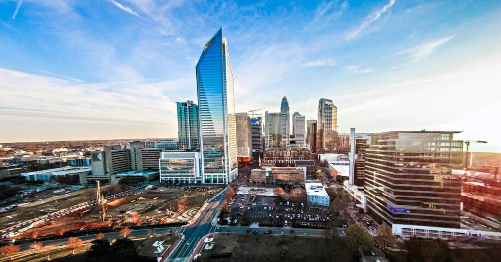An aerial view of a city skyline with a lot of tall buildings.