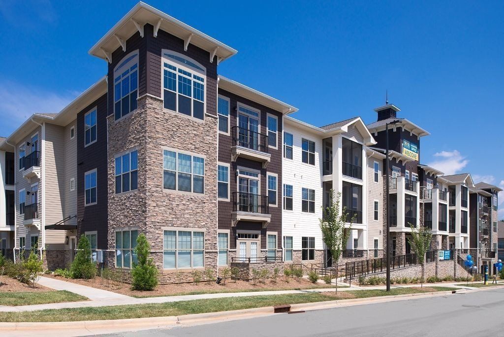 A large apartment building with a lot of windows