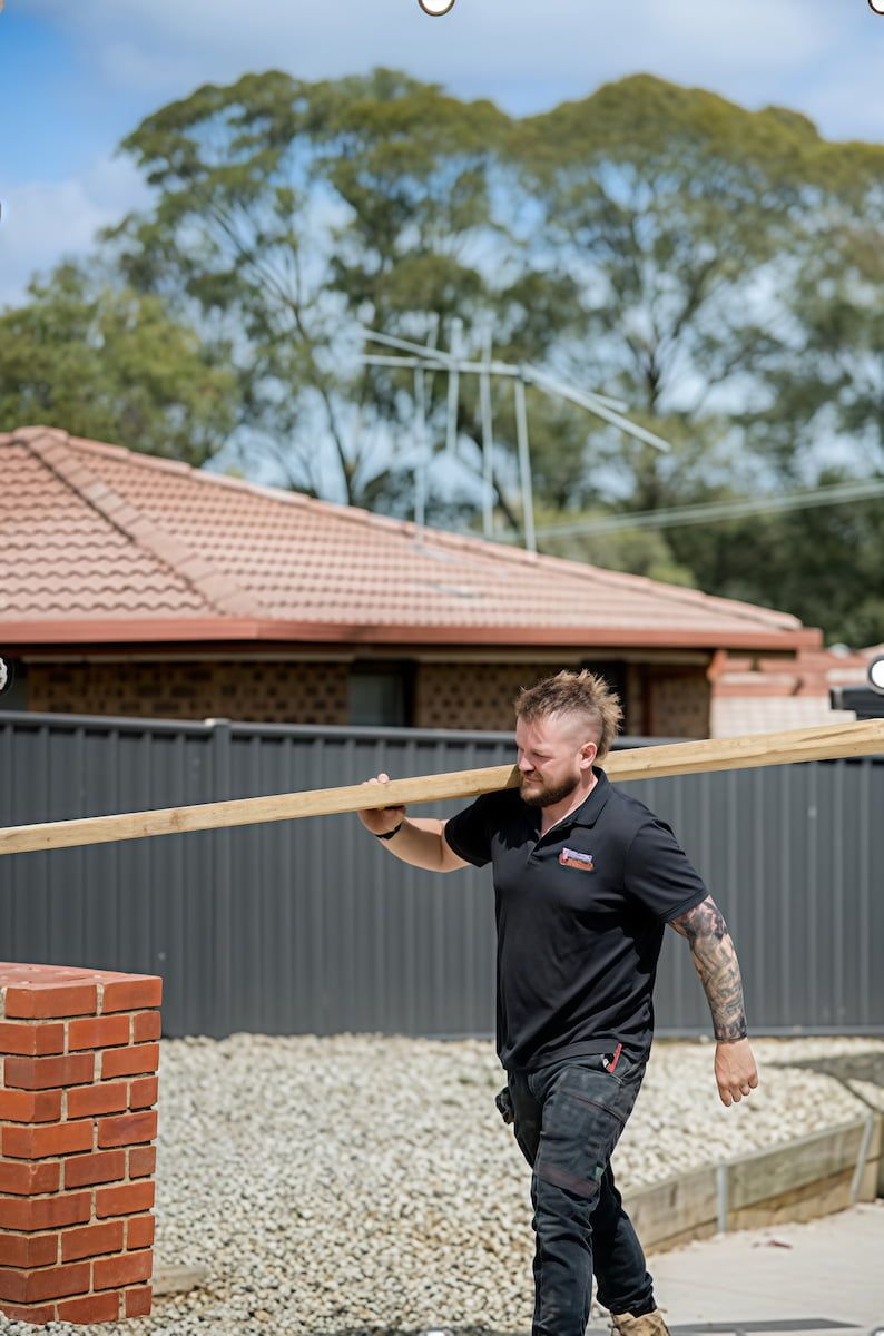 A Person Carrying Timber/materials — 2easy Cleaning in Bendigo, VIC