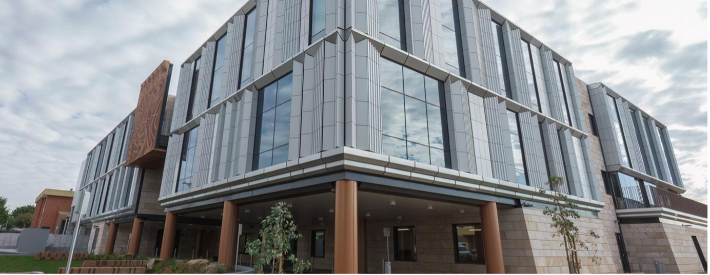 A Man Is Standing in Front of A Large Window on A Balcony  — 2easy Cleaning in Bendigo, VIC