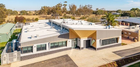 A Man Is Standing in Front of A Large Window on A Balcony  — 2easy Cleaning in Bendigo, VIC