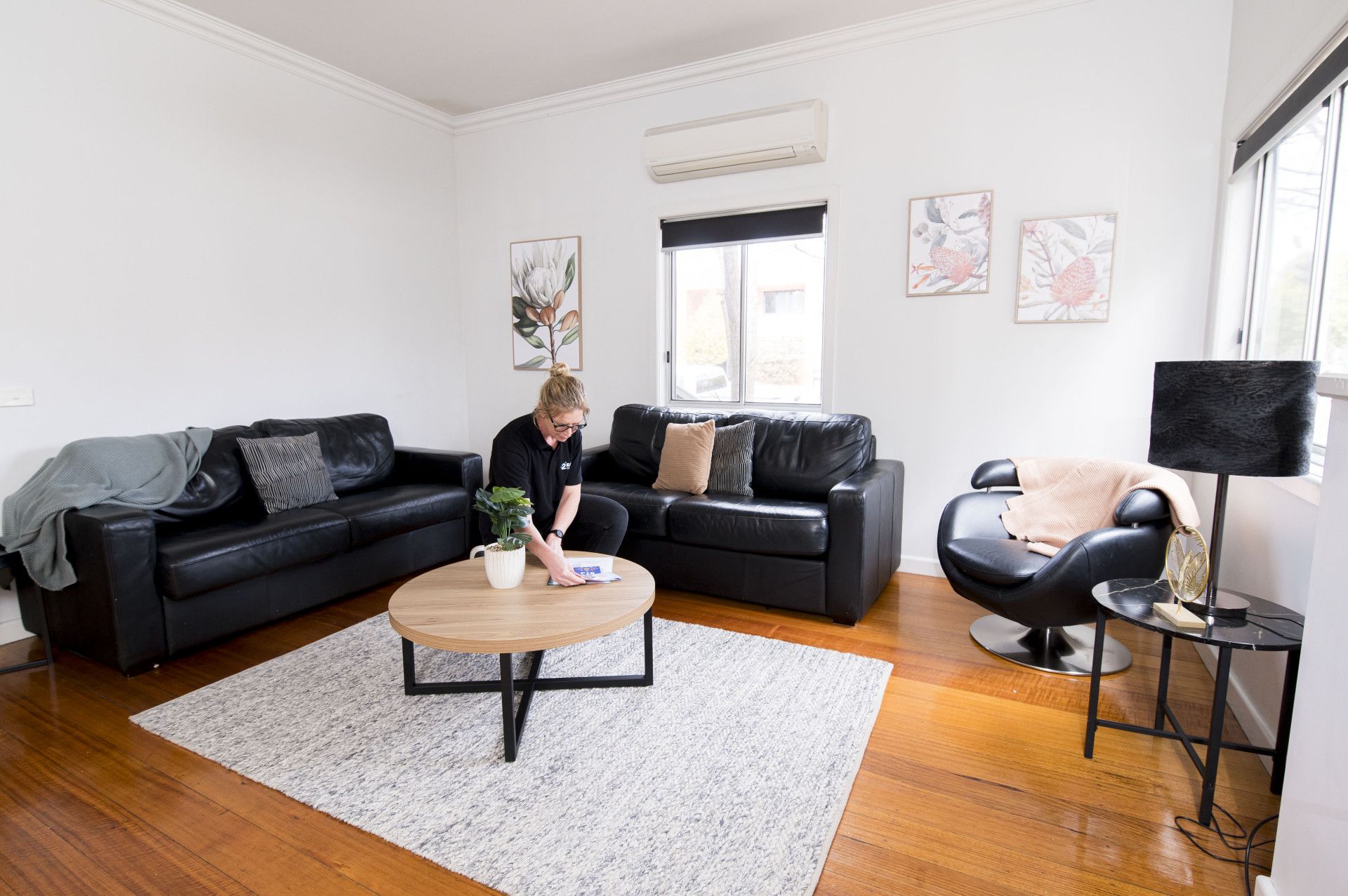 A Woman Is Cleaning A Coffee Table— 2easy Cleaning in Bendigo, VIC