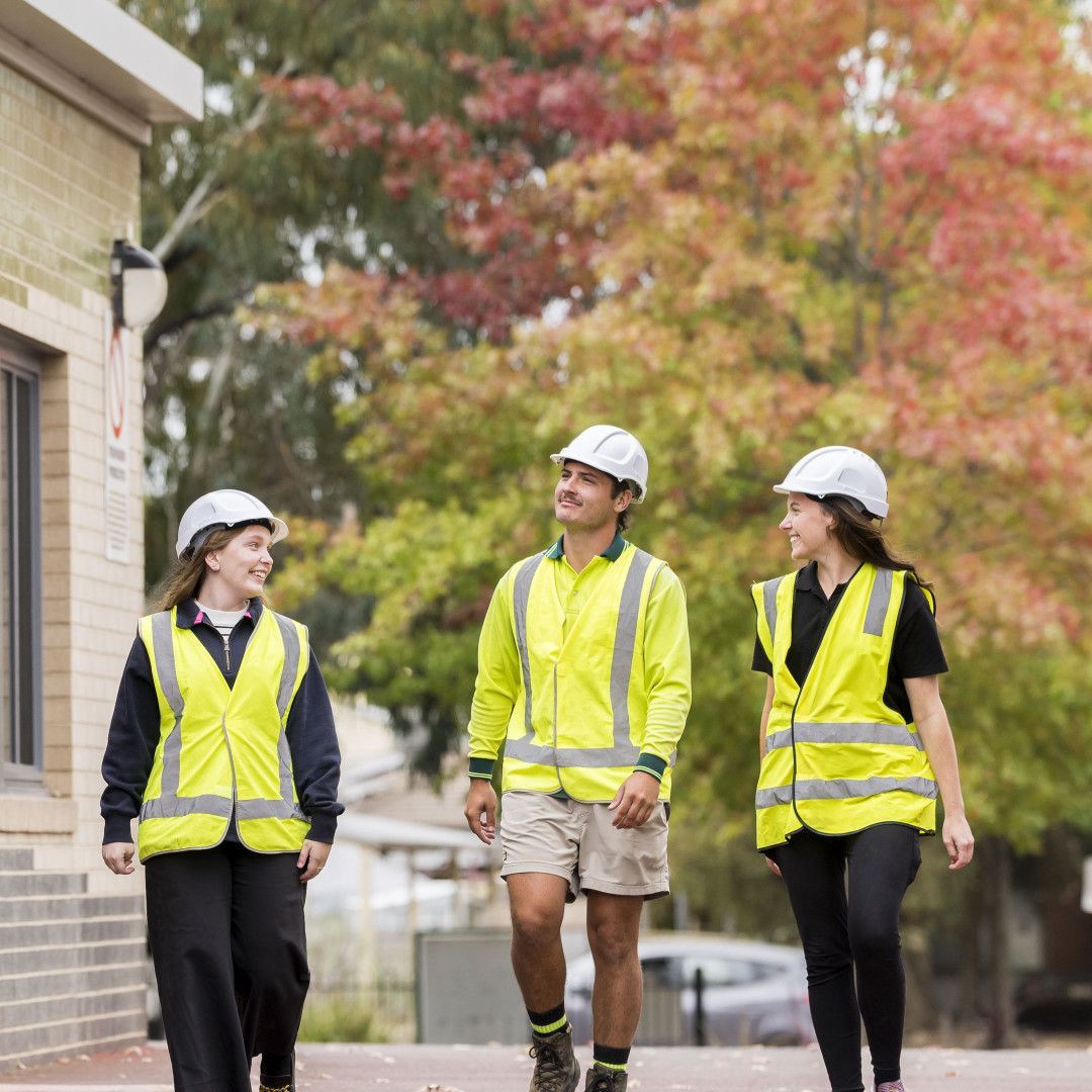 A Person Wearing Green Gloves Is Cleaning a Tile Floor with A Brush — 2easy Cleaning in Bendigo, VIC