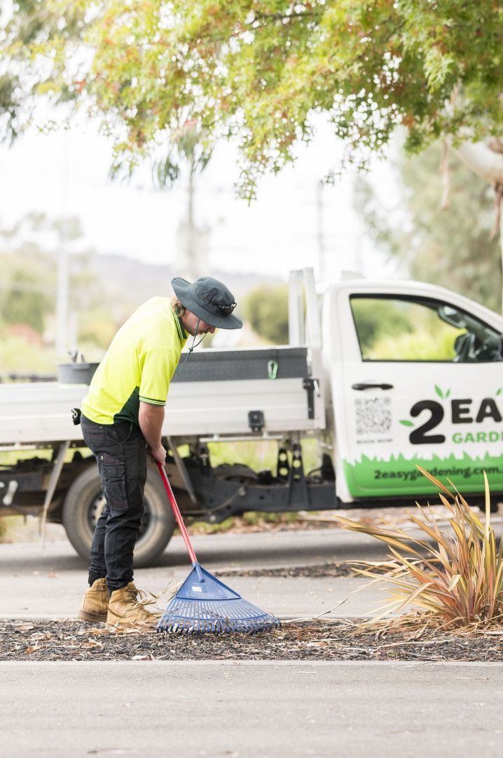 A Man Is Raking Leave — 2easy Cleaning in Bendigo, VIC