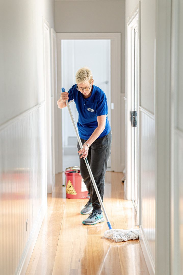 A Woman Is Moping The Floors — 2easy Cleaning in Bendigo, VIC