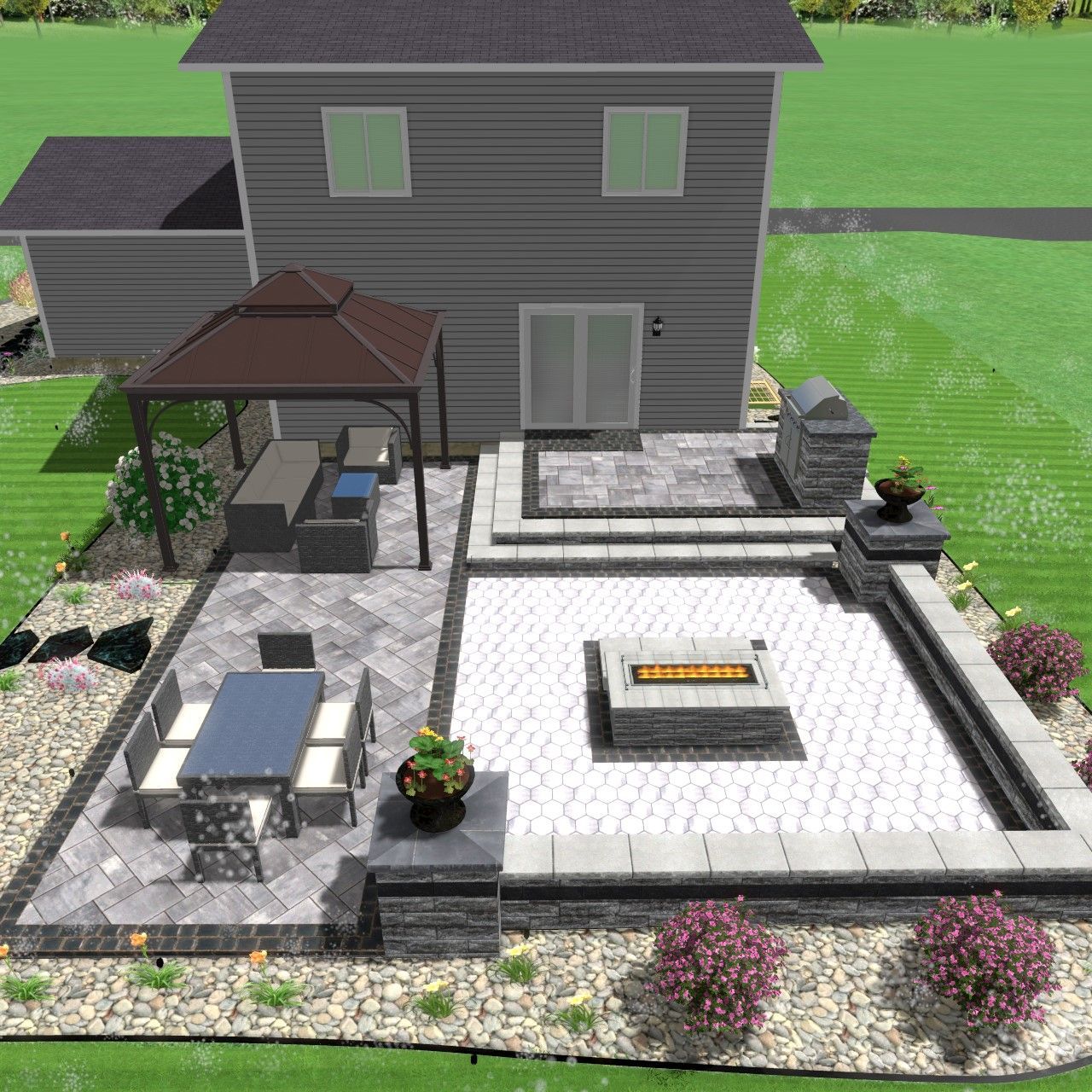 An aerial view of a house with a patio and a fire pit.