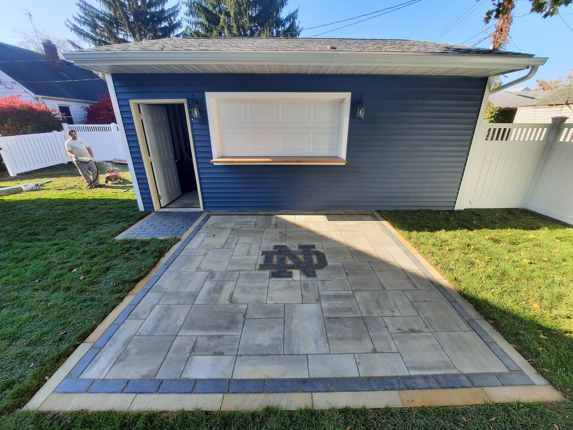 A small house with a patio in front of it.