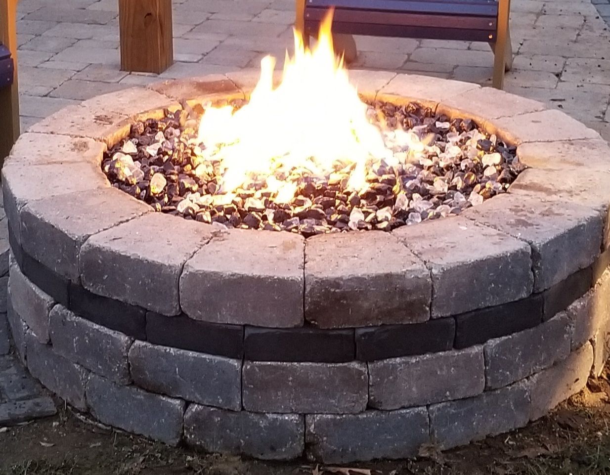 A fire pit with a lot of rocks in it