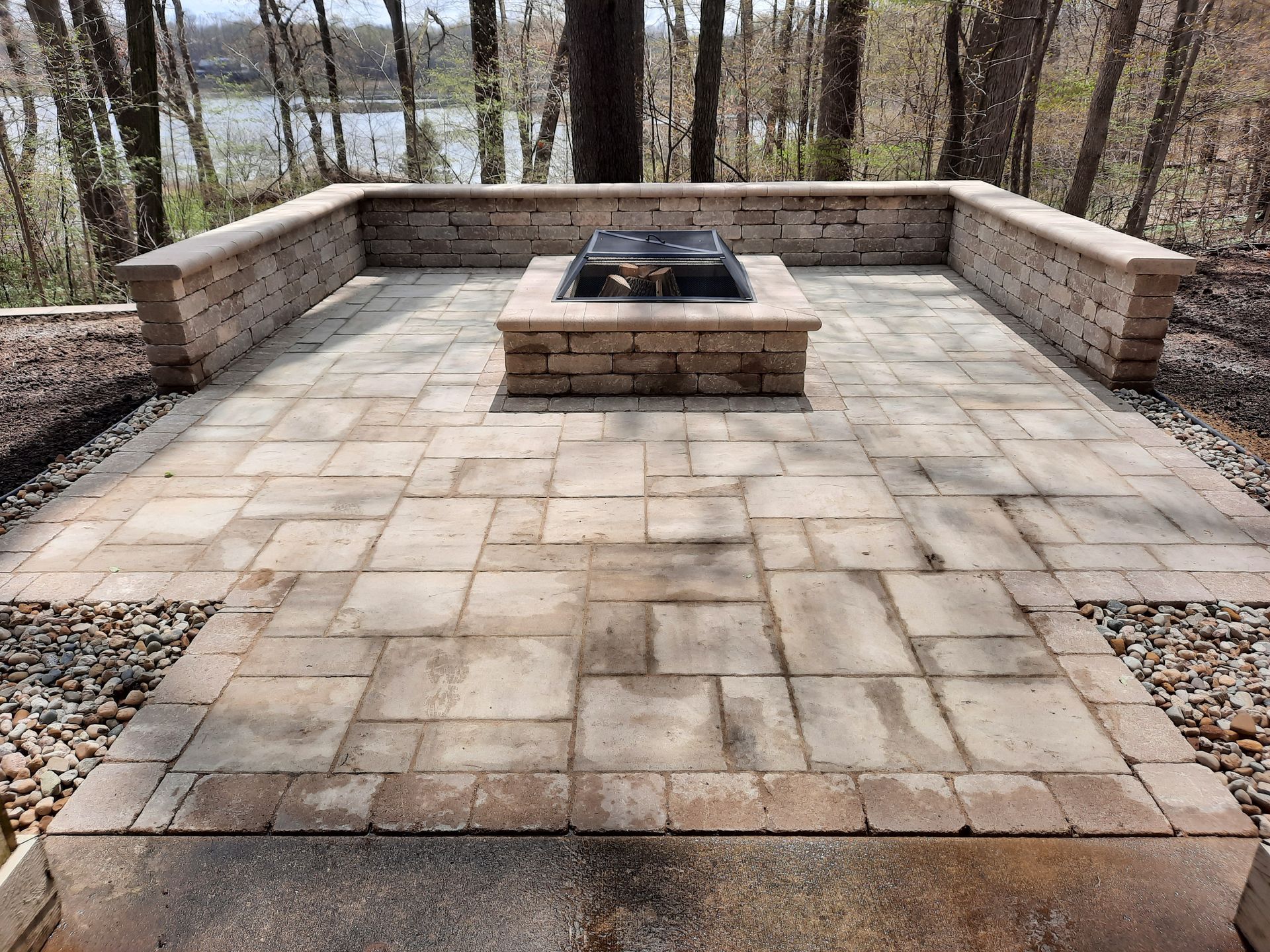 There is a fire pit in the middle of the patio.