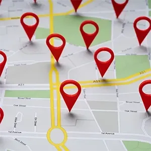 Map with multiple red location pins marking destinations along yellow roads.